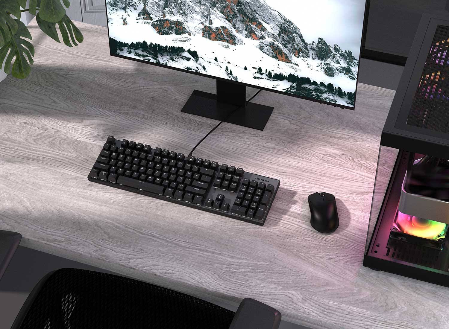Clavier mécanique Cougar Ultimus EX Black sur un bureau en bois , offrant un design épuré et puissant pour les setups gaming chez FlowUP