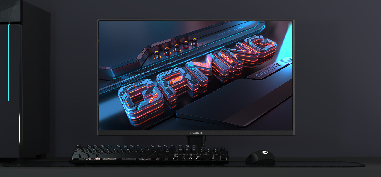 Écran gaming GIGABYTE GS25F2 de 25 pouces avec dalle Super Speed IPS affichant une image dynamique "Gaming", accompagné d'un clavier et d'une souris sur le site FlowUP